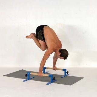 Tuck straight-arm press-to-handstand