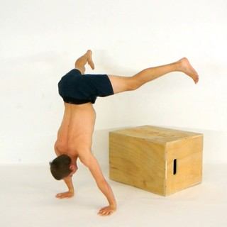Elevated straddle press-to-handstand
