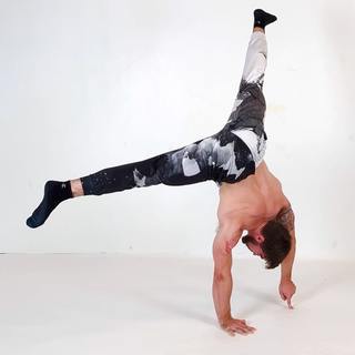 Straddle handstand with 1 finger support