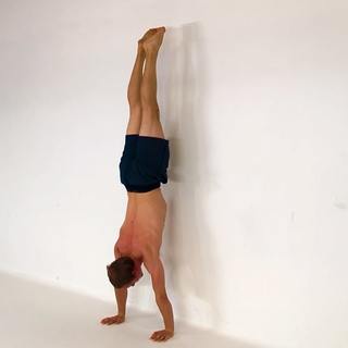 Wall handstand toe pulls