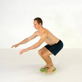 Wobble board half squat