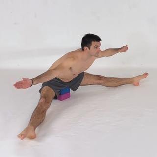 Assisted sitting straddle stretch