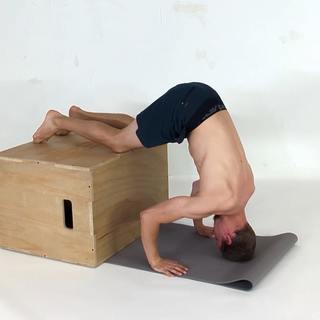 Box knee tripod headstand