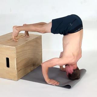 Box tripod headstand