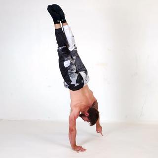 One-arm handstand fingertip tap