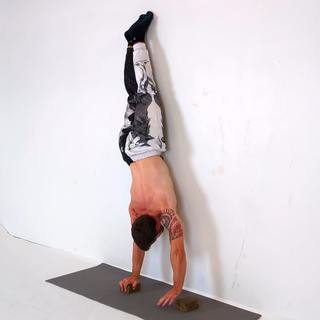 Wall handstand block walk
