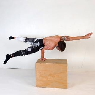 Elevated one-arm straddle elbow lever