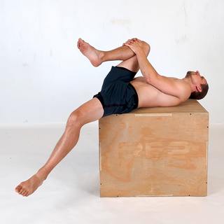 Supine hip flexor stretch