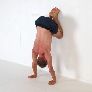 Wall tuck handstand hold