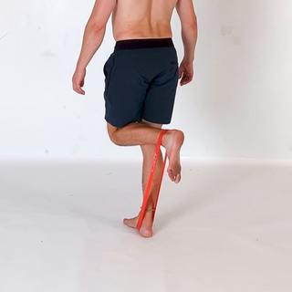 Banded hamstring curl standing