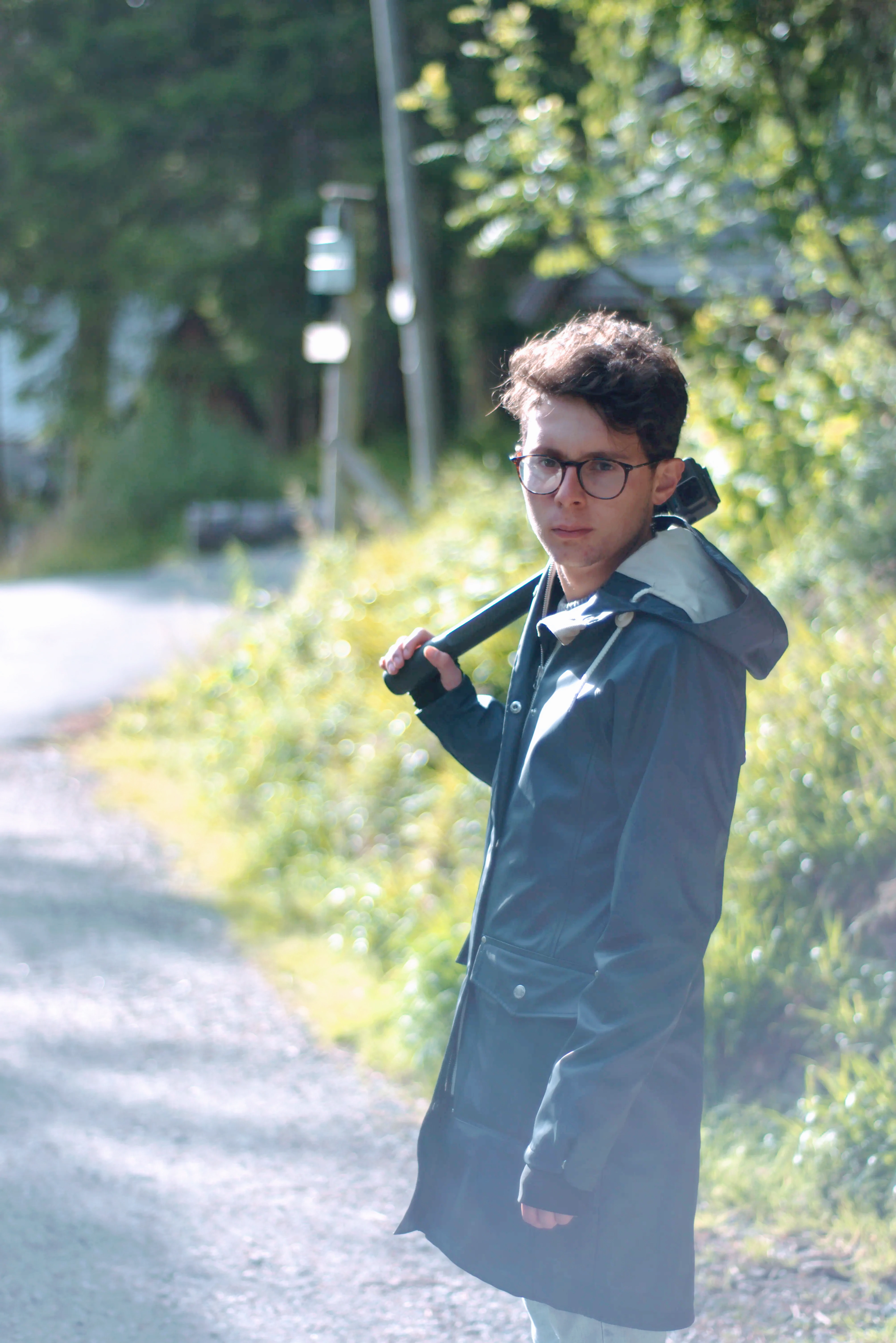 Photo of camilo with a green background looking at the camera