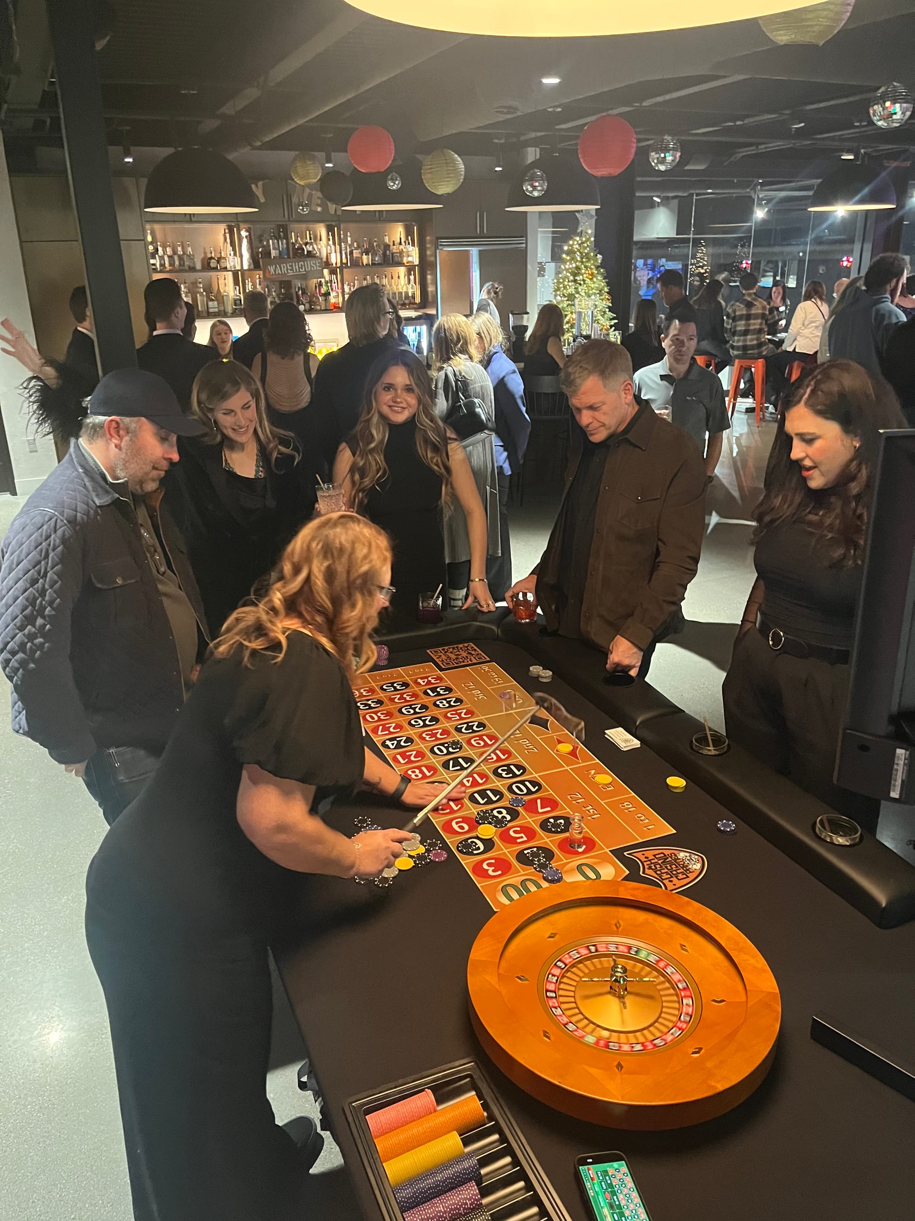 Casino tables and guests at New Year's Eve at Warehouse Motor Club, a corporate casino party in Northern Utah