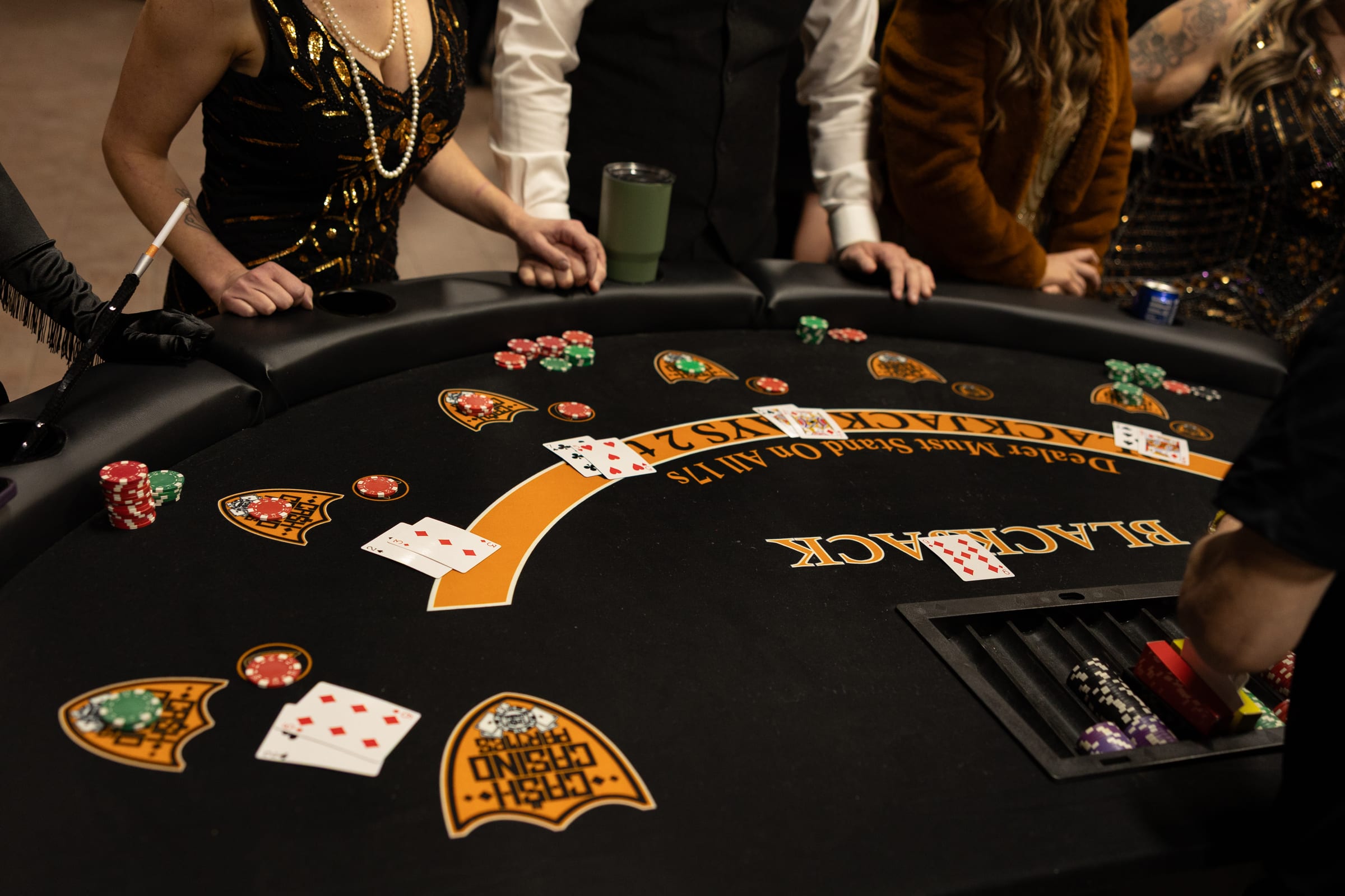Casino tables and guests at Whiskey Throttle Race Night, a corporate casino party in Northern Utah