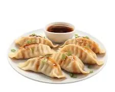 E12 Raviolis japonais au poulet et legumes grilles 6p