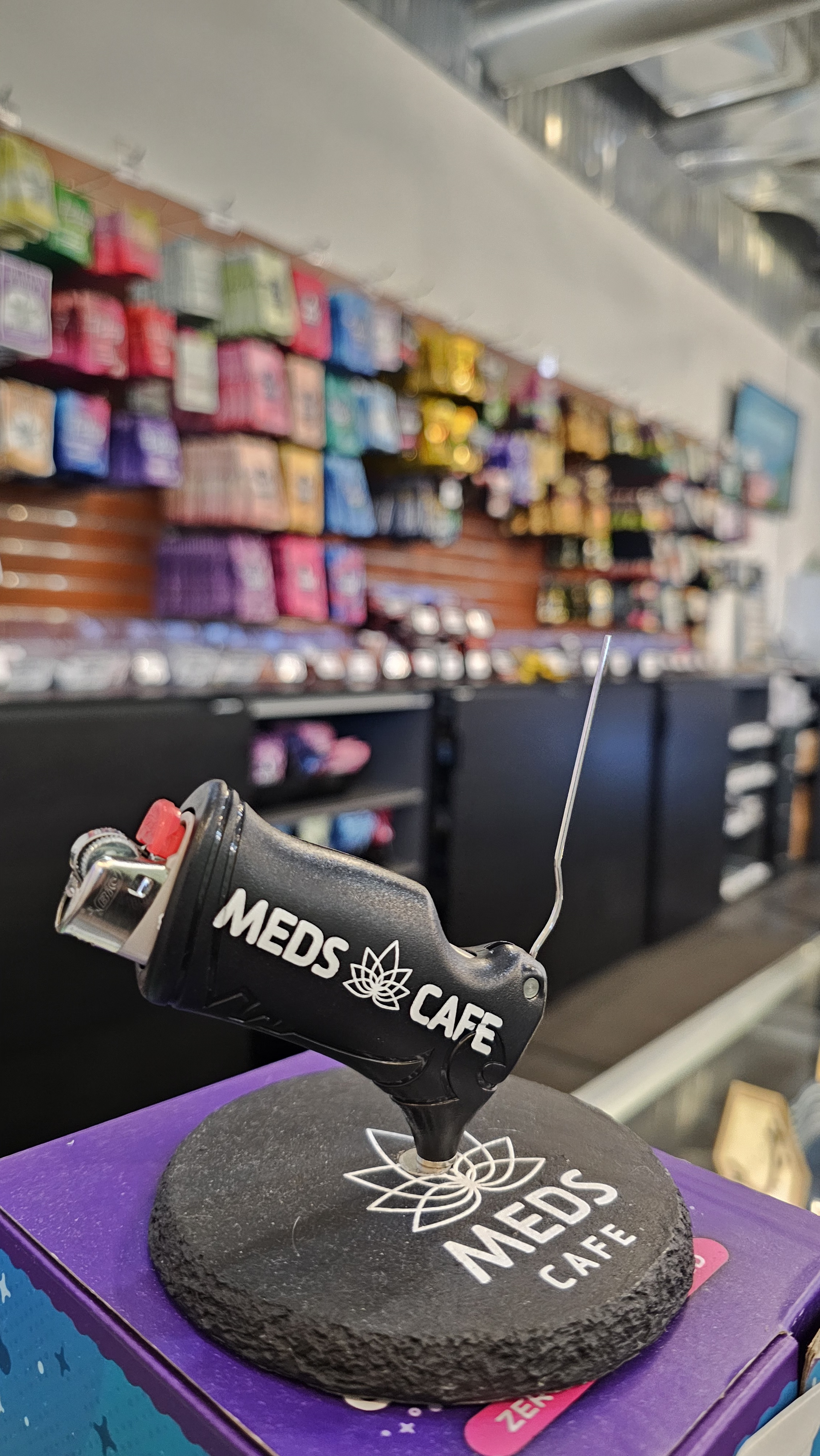 Meds Cafe Lowell interior — deli-style flower counter on W Main St
