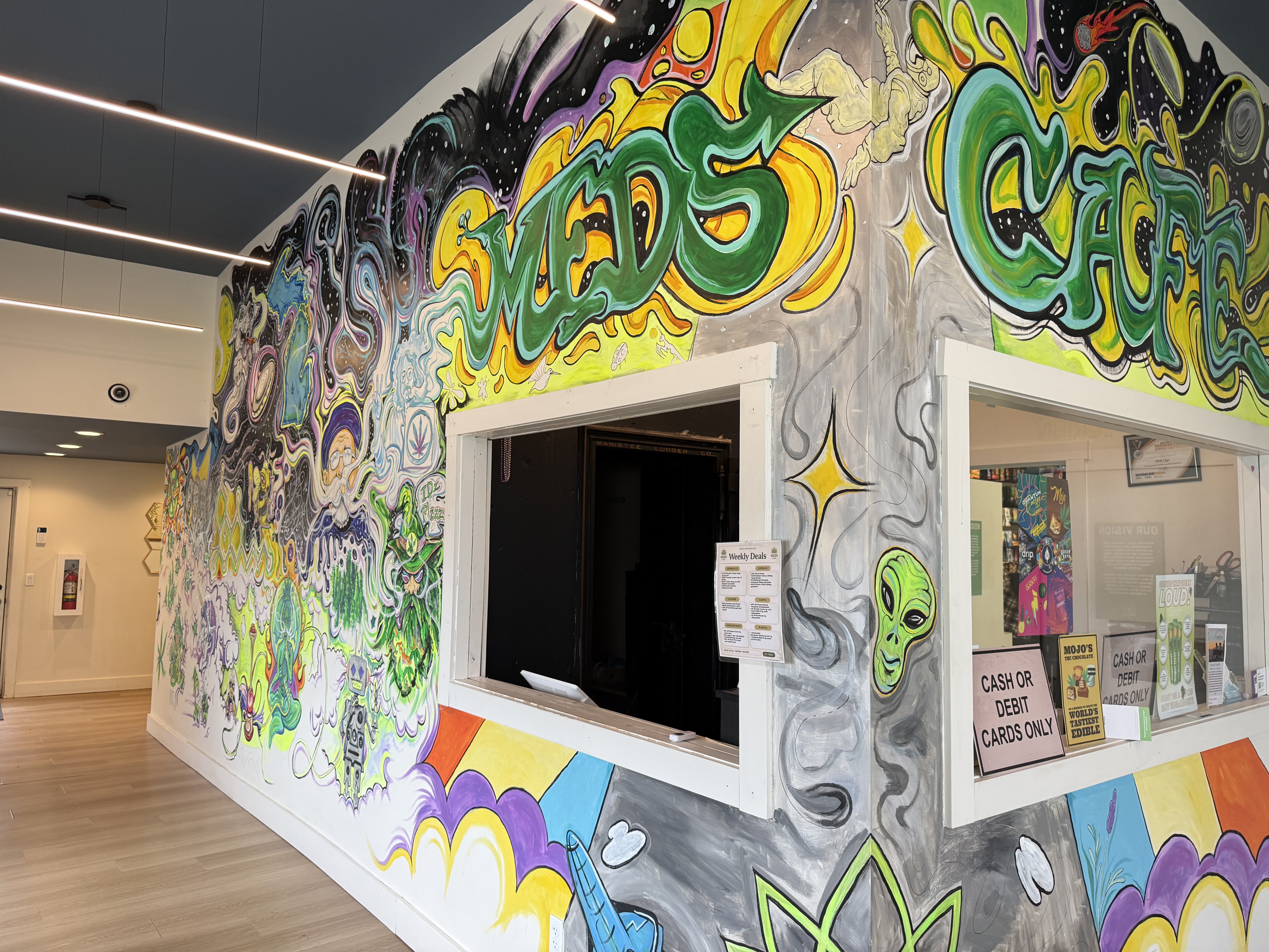 Meds Cafe Manistee — cannabis retail space on Arthur St