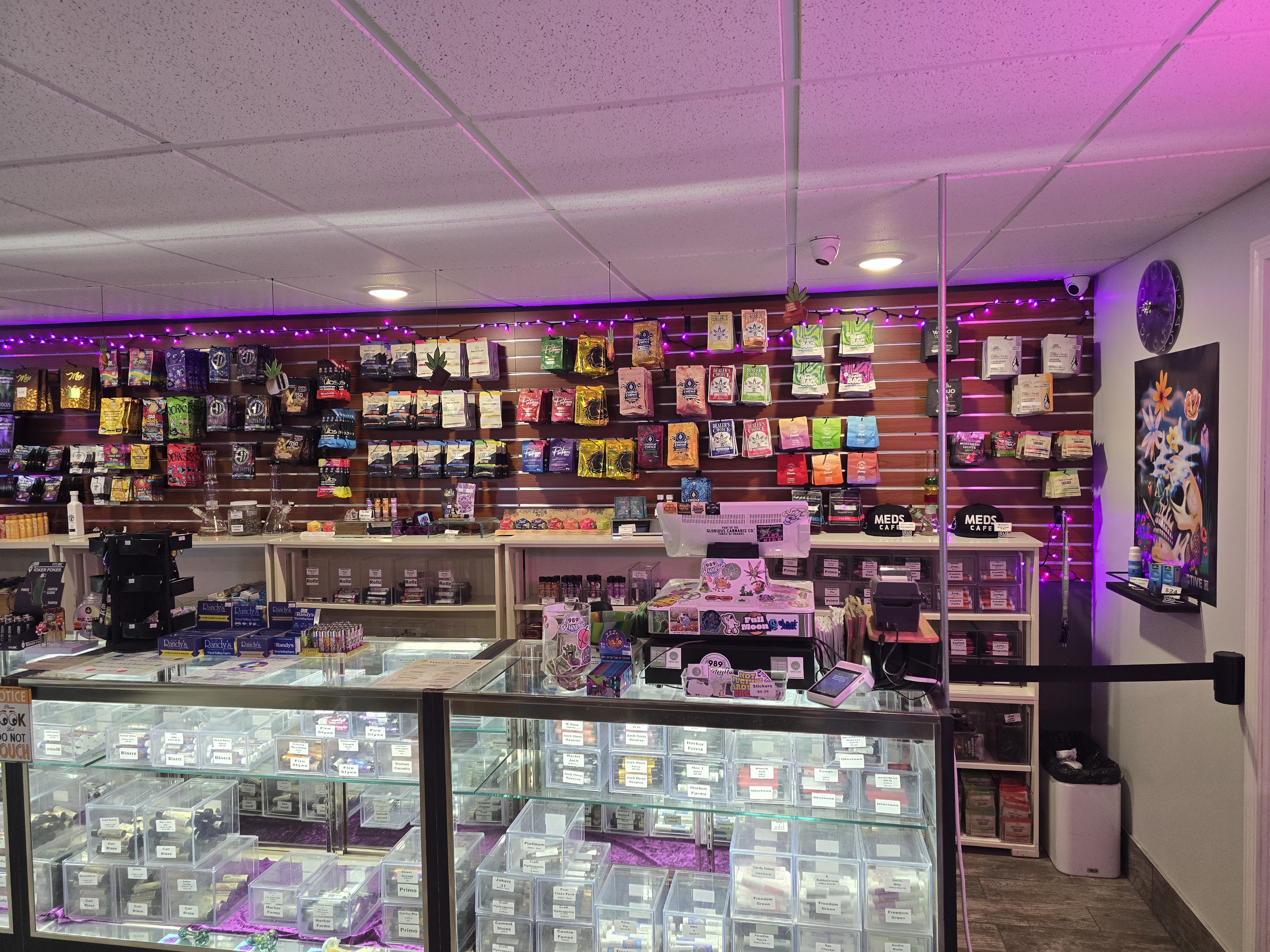 Meds Cafe Rogers City — product display and deli-style counter