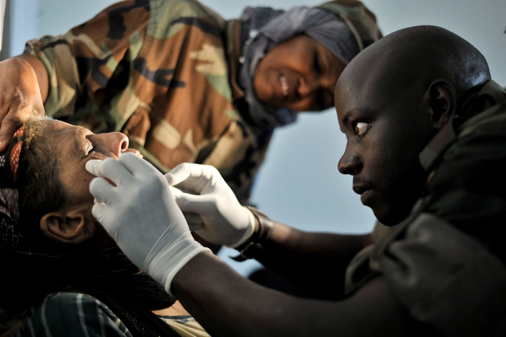 Ugandan army dentist removes rotten