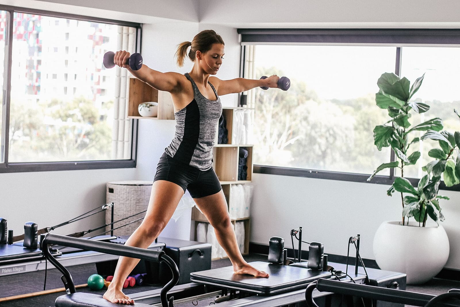 Reformer pilates in a bright boutique studio