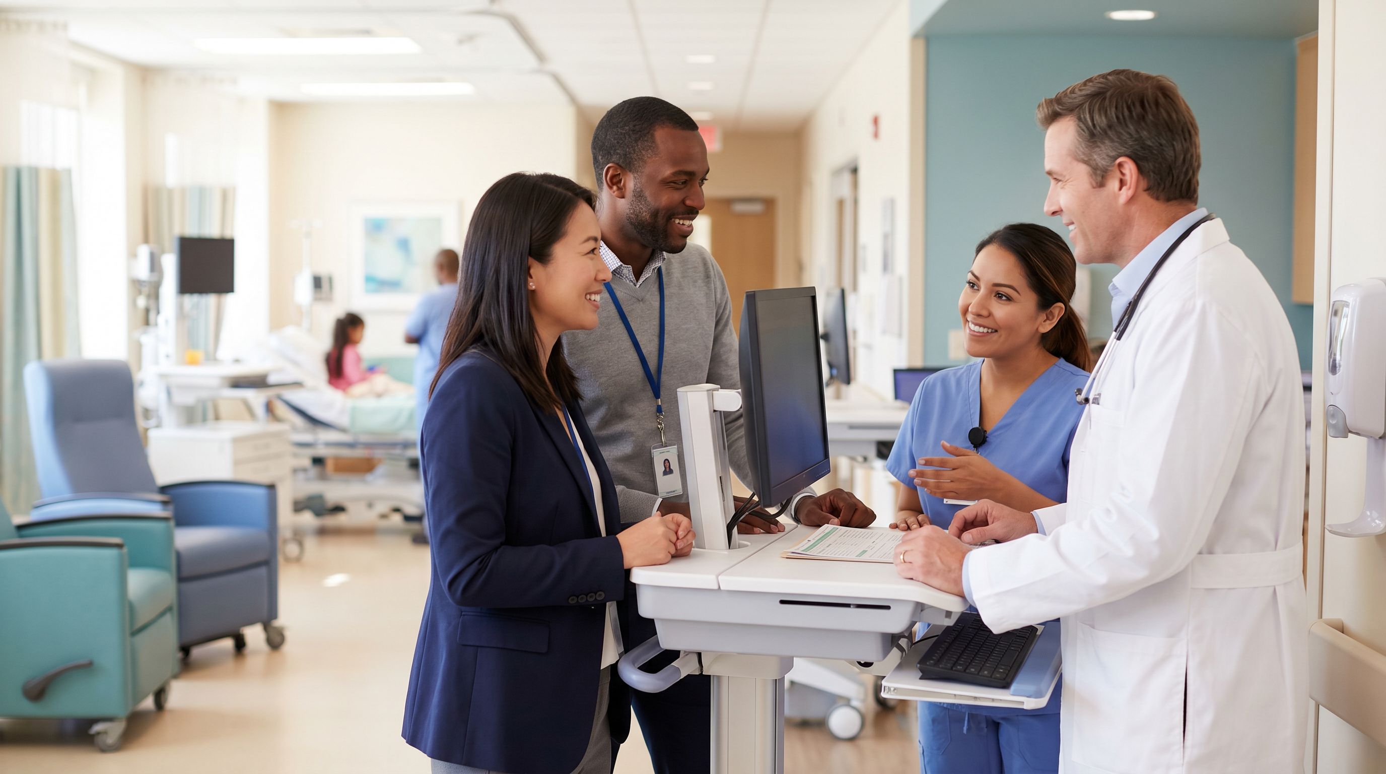 A Board Certified Behavior Analyst collaborating with clinical staff at a workstation in a modern hospital