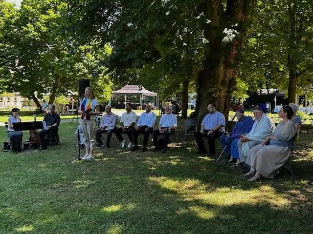 representatives from multiple theological backgrounds pray together