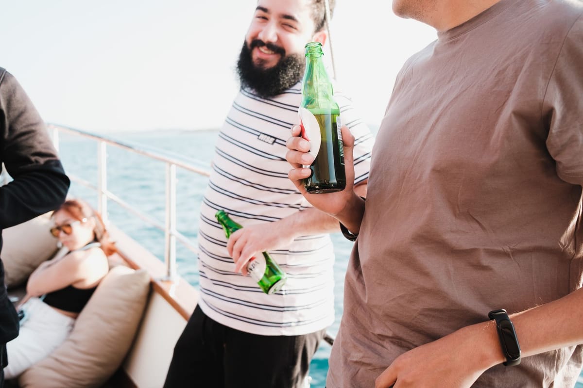 A group of friends celebrating on the deck of a charter yacht off the Florida coast.