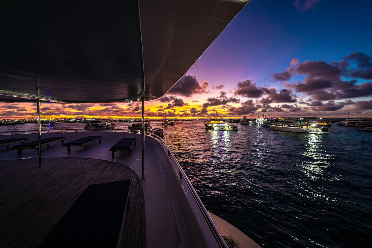 A group of friends celebrating on a yacht deck on a sunny day in Miami waters.