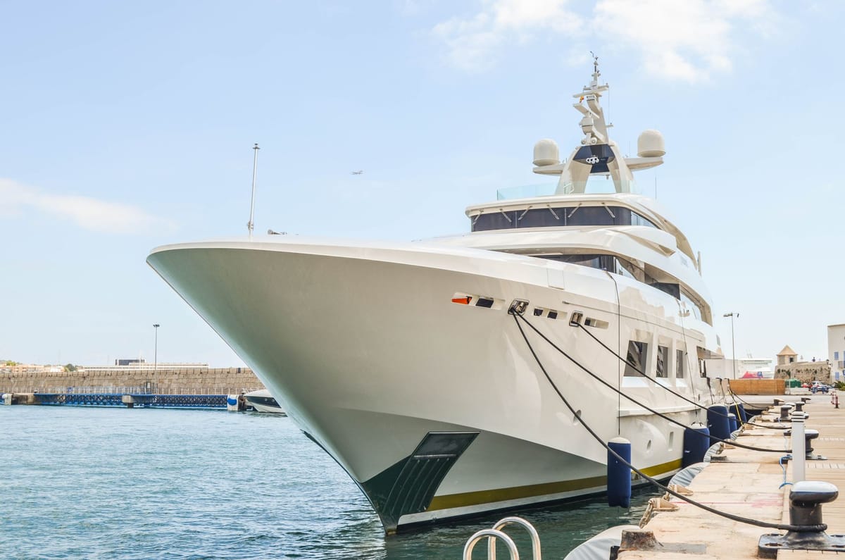 A licensed yacht captain reviewing charter paperwork at a Florida marina dock.