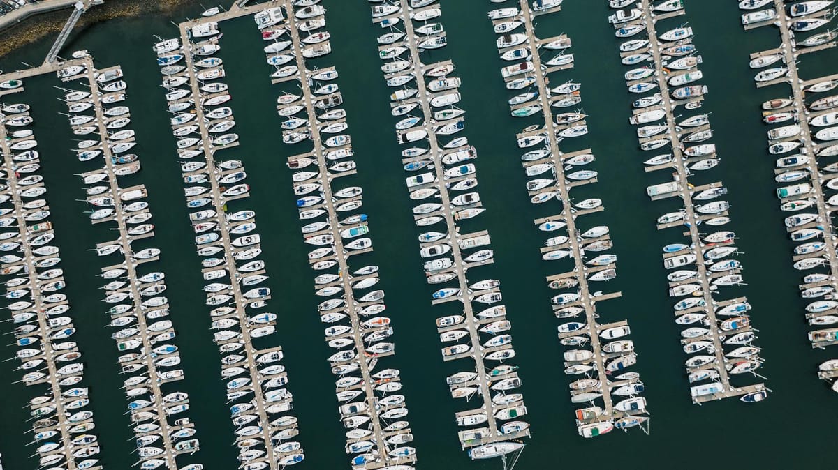 A licensed captain at the helm of a motor yacht navigating Miami's waterways.