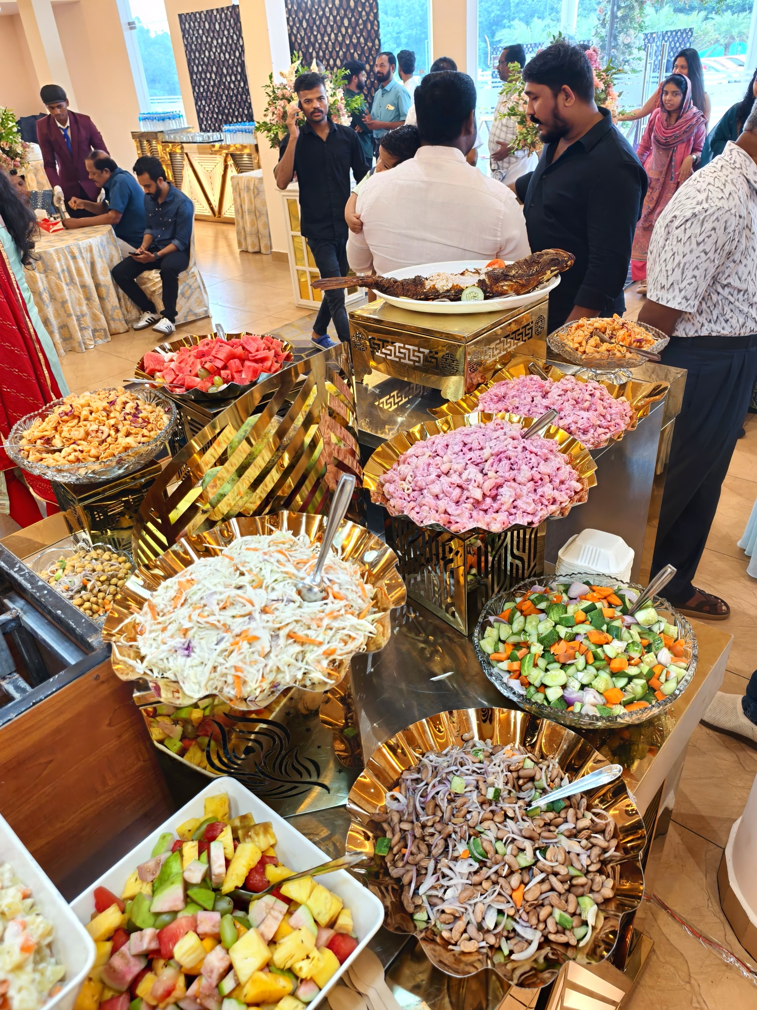 Professionals networking at a corporate event with food