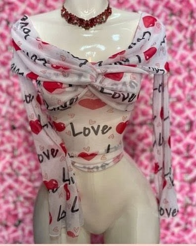 Blusa de mesh estampado Love con nudo y manga larga