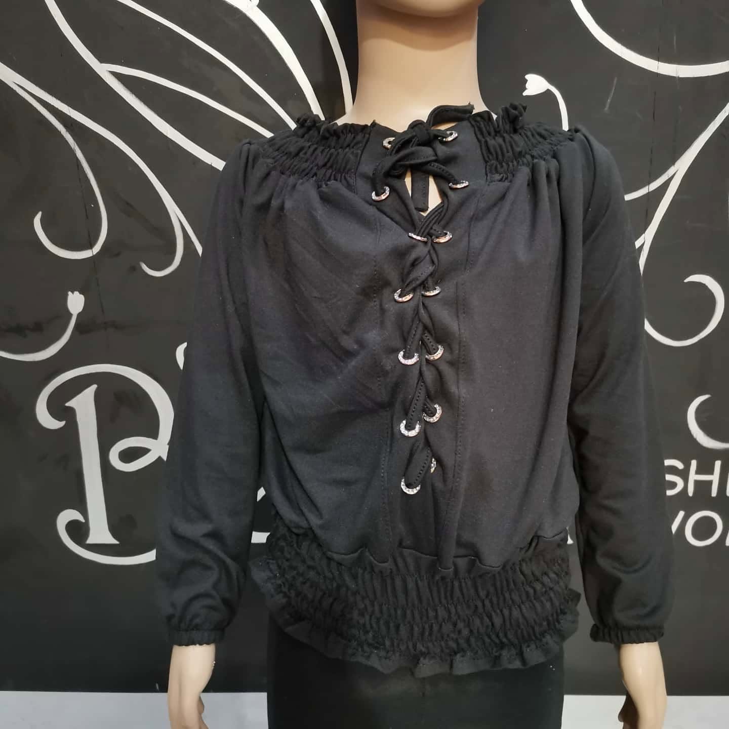 Blusa de niña manga larga con agujetas y cintura fruncida