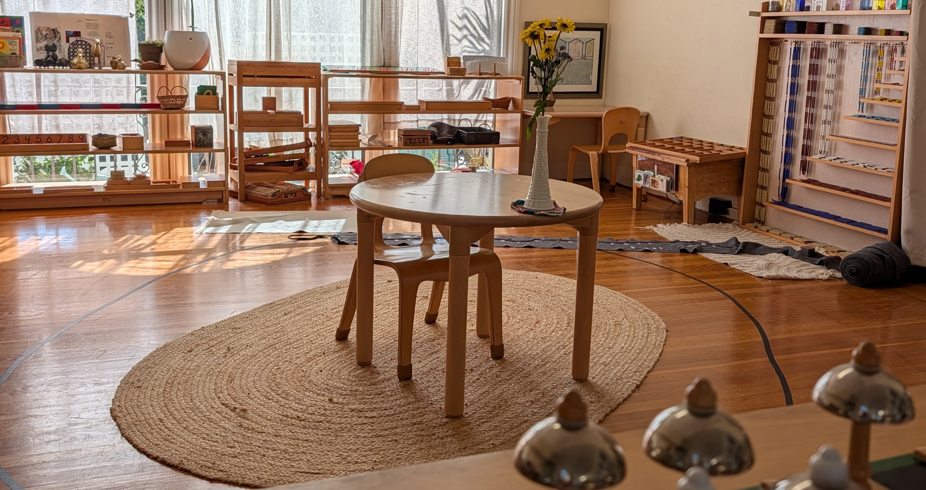 Image for homepage philosophy section: a child carefully working with Montessori wooden materials.