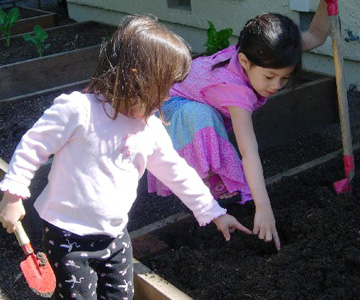 Image for philosophy page (method section): A child working with Montessori materials.