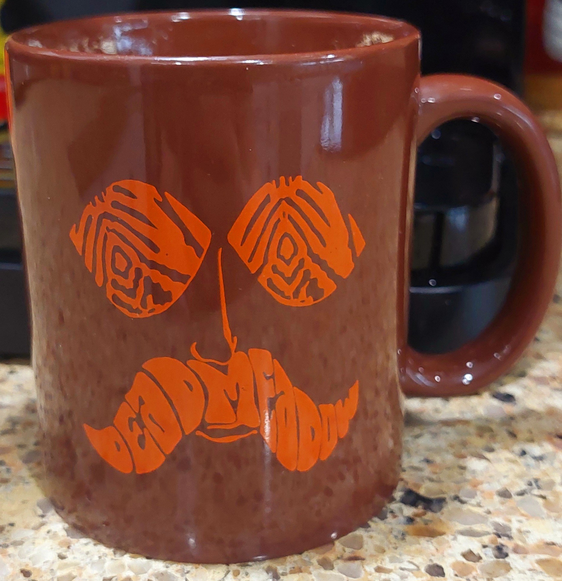 ☕️ MUG COLLECTION ☕️
Dead Meadow (band) Mug: Side 2 
(Might be hard to tell, but the mustache is lettering that says 