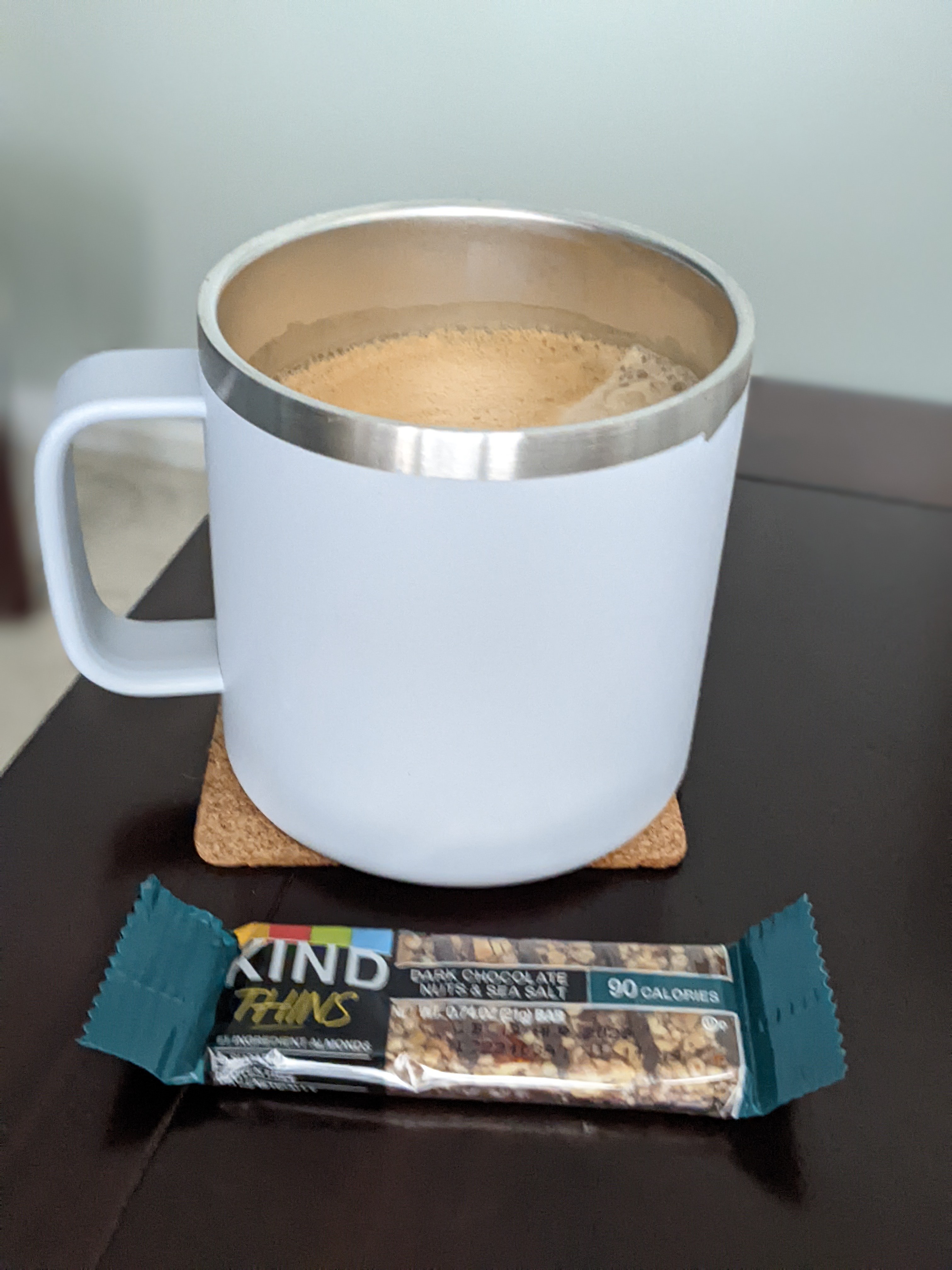 Having a breakfast bar and coffee to make it through the morning meetings