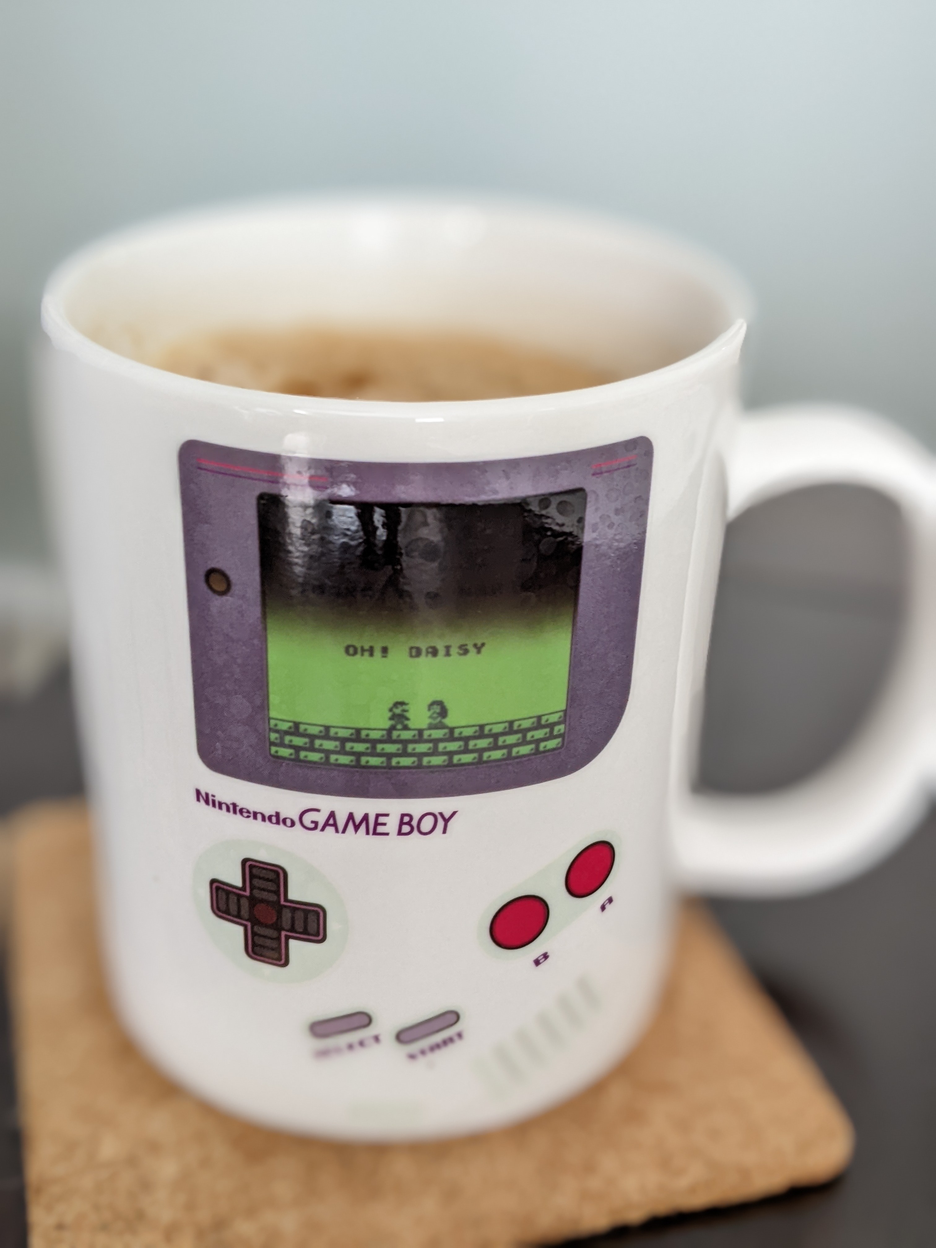 Enjoying a roasty coffee after a day of meetings.  It's too bad the coffee doesn't show the whole screen on the mug.