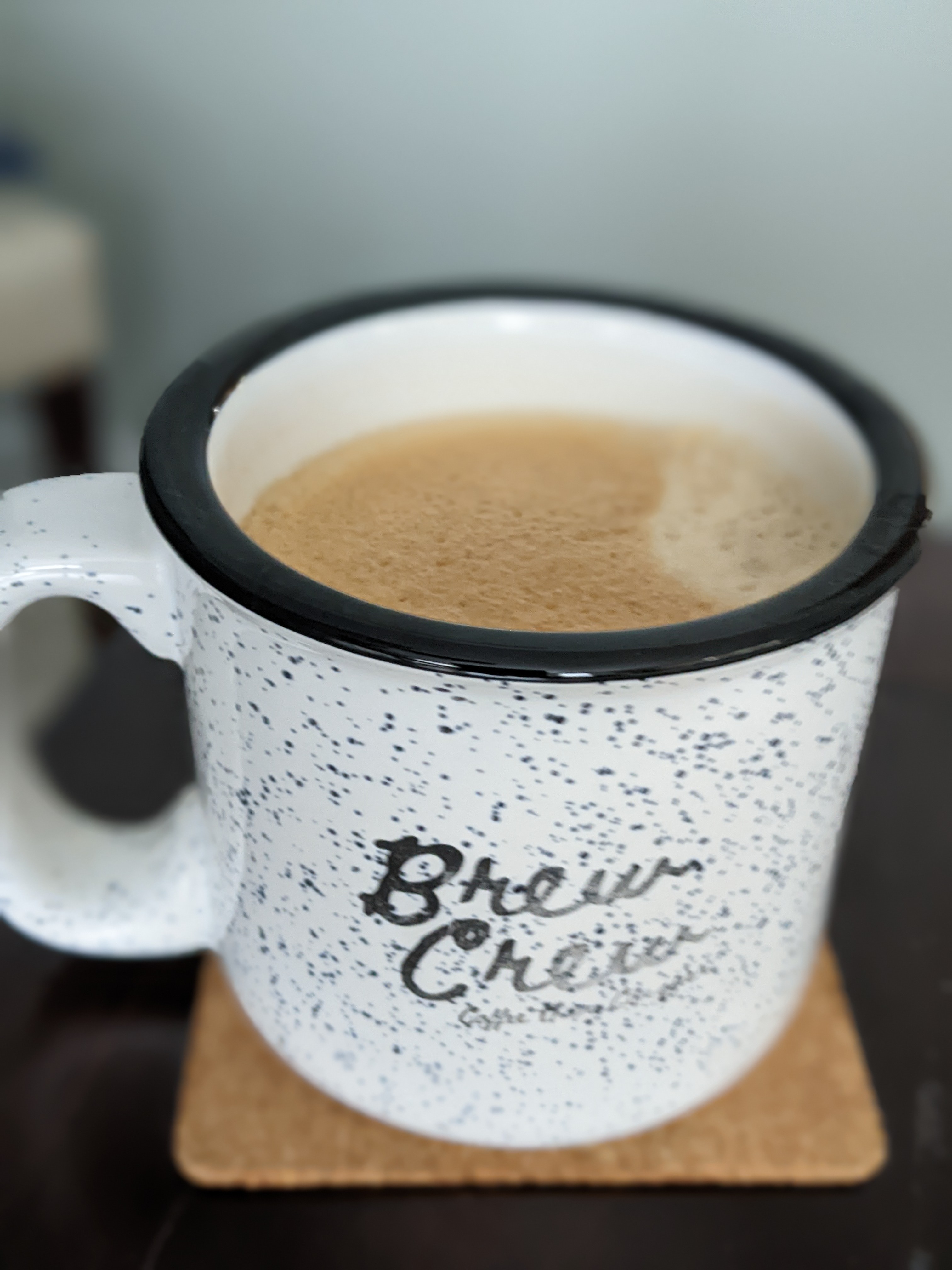 Drinking coffee while hearing the sound of neighbors mowing their lawns