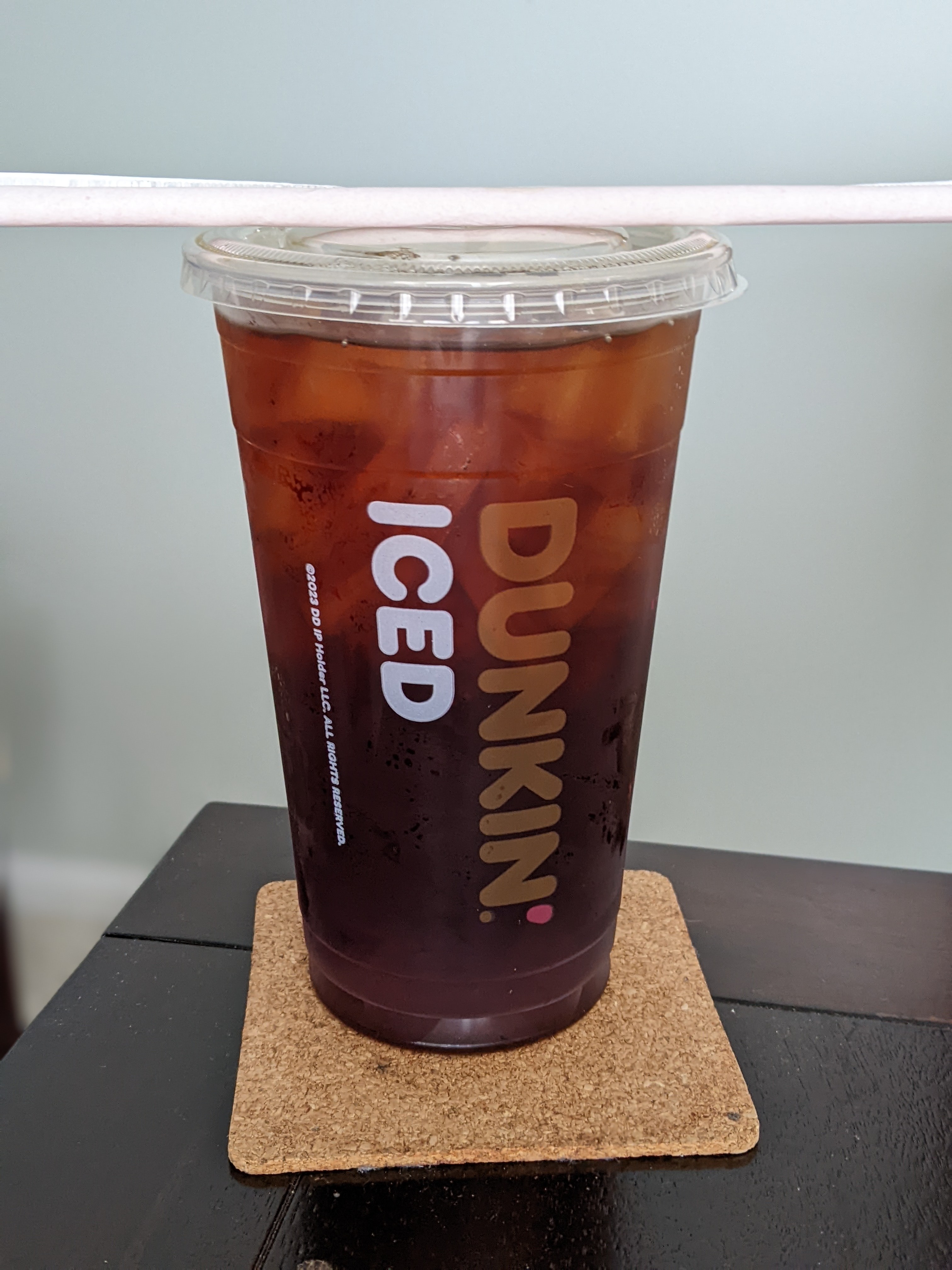 Drinking a free iced coffee from Dunkin between meetings