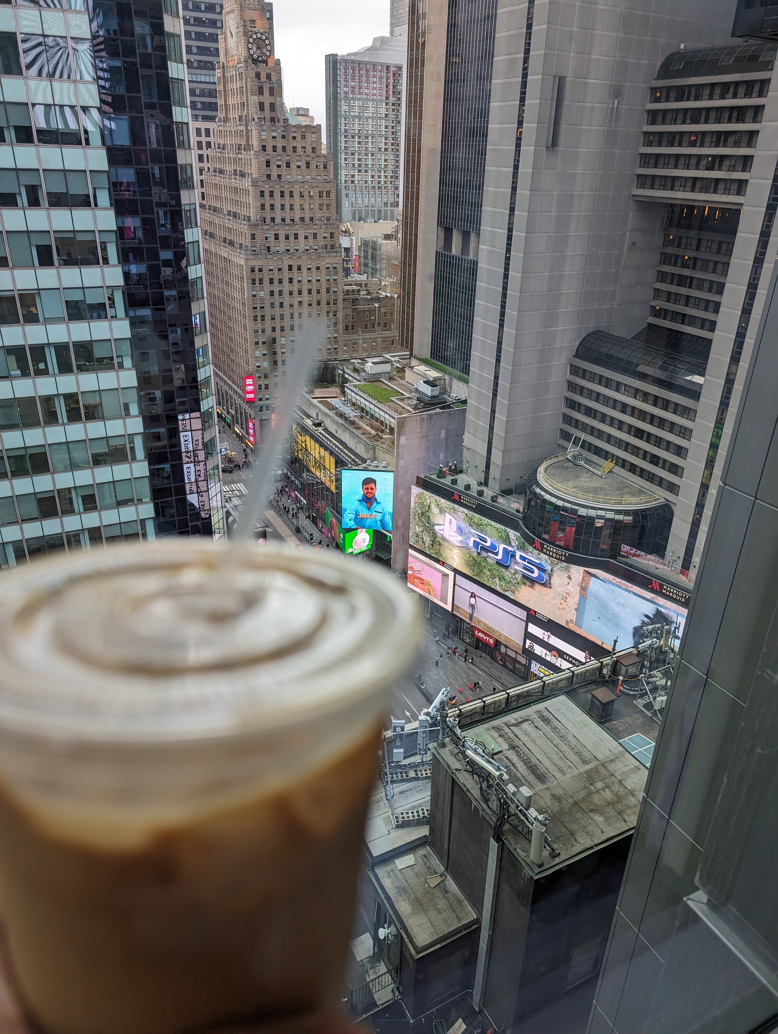 Having a morning iced mocha with breakfast overlooking Times Square