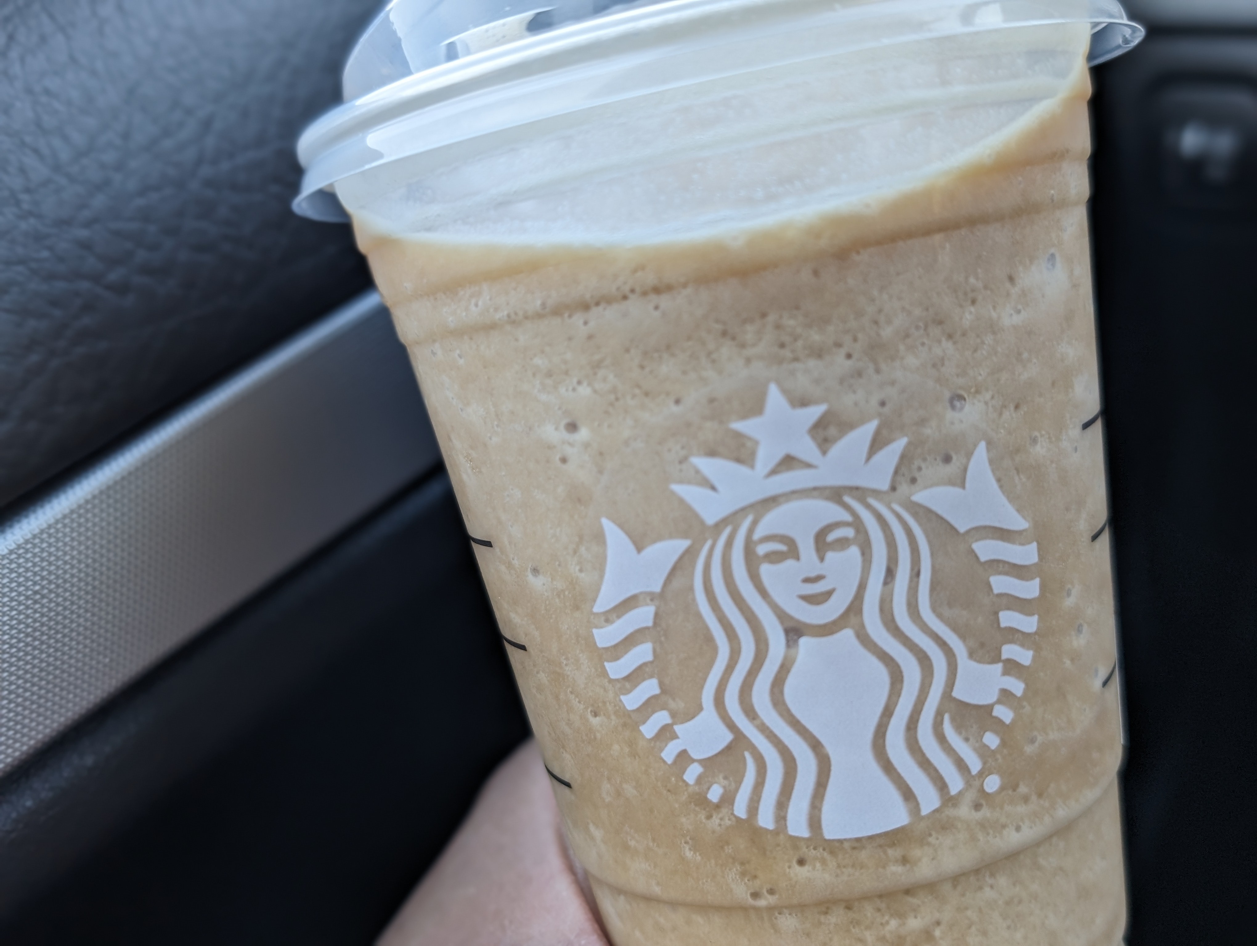 Enjoying an espresso frappuccino on the way home