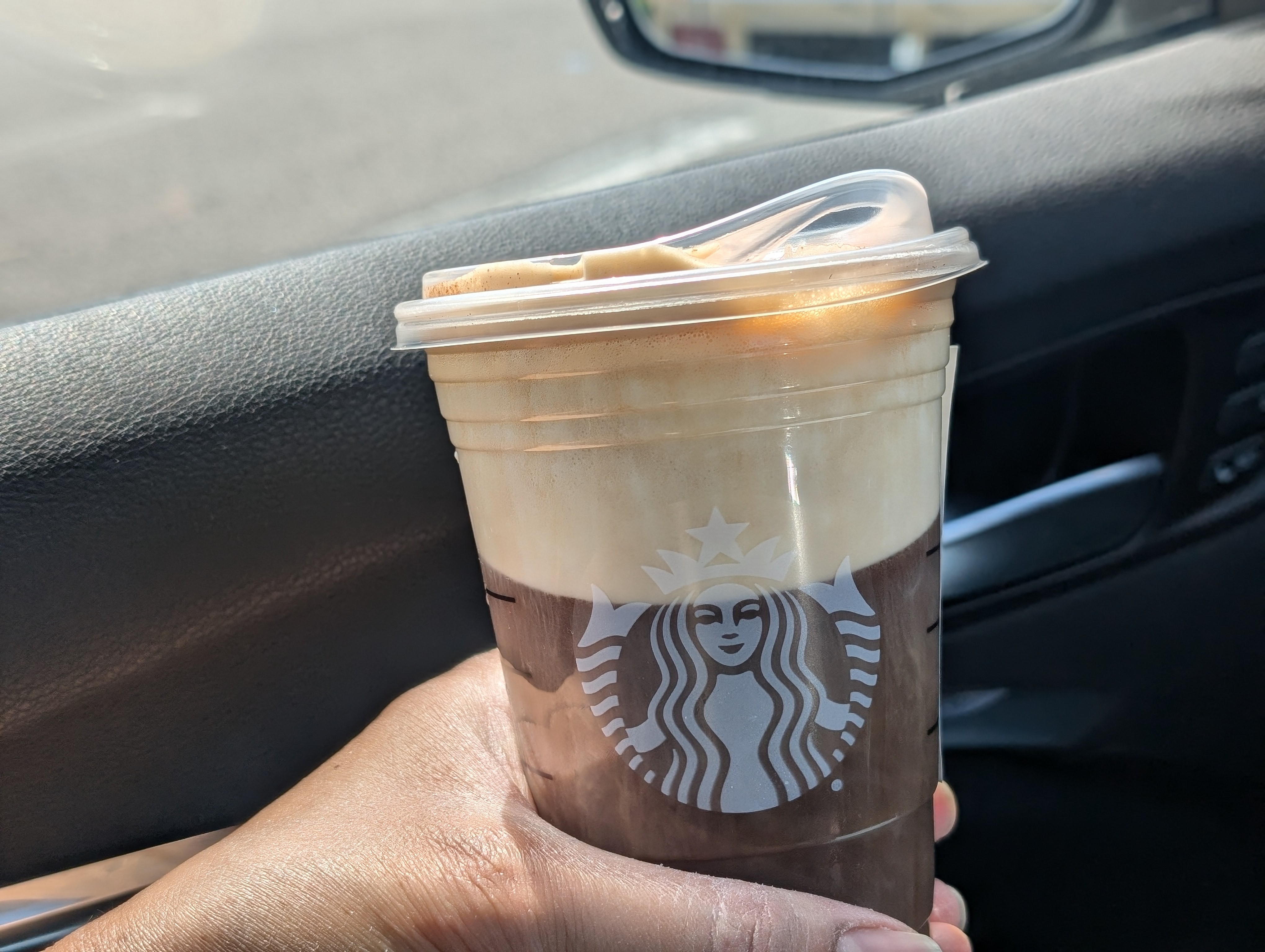 Enjoying a cinnamon caramel nitro cold brew for the long drive