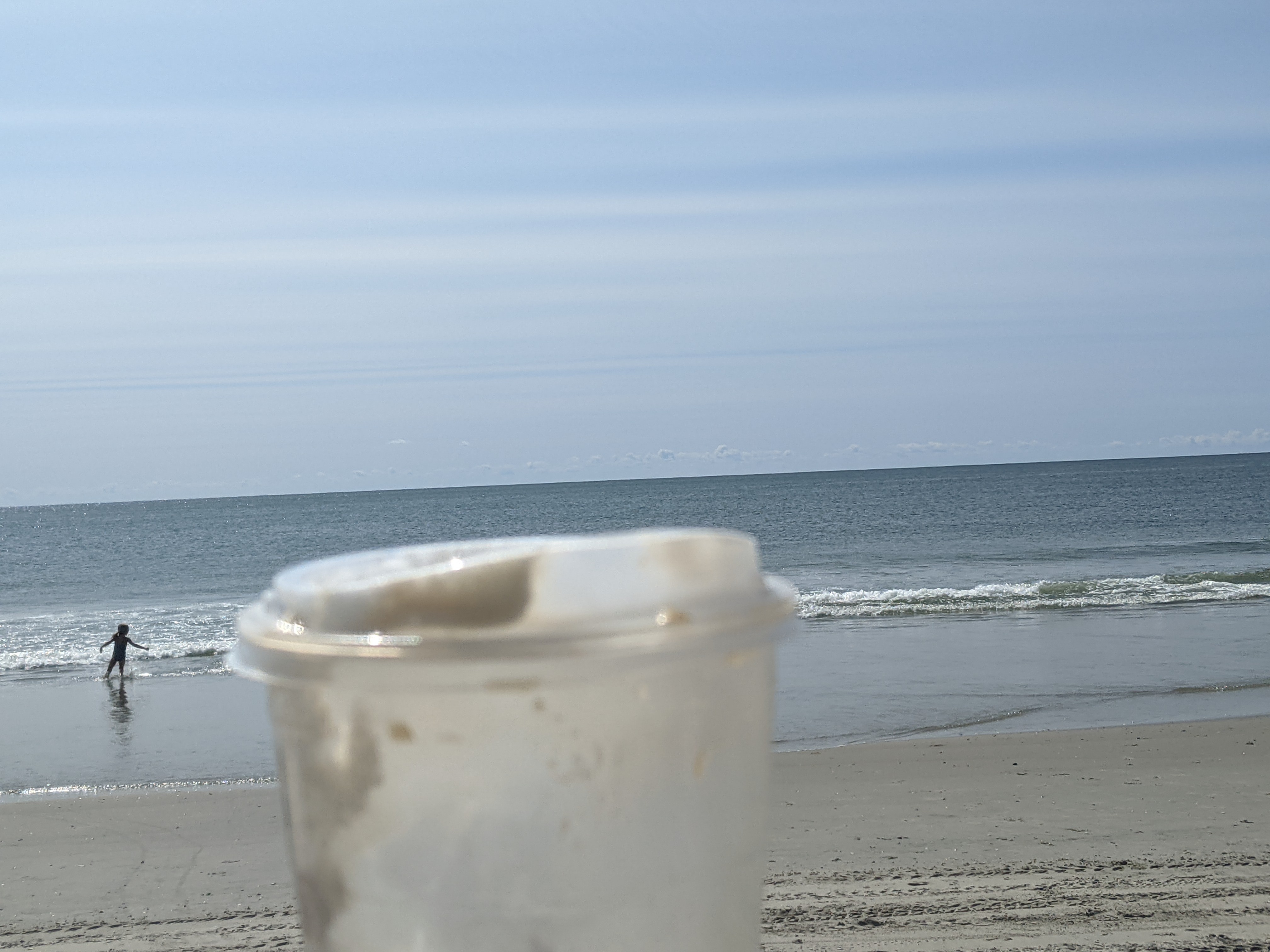 Finishing the coffee at the beach