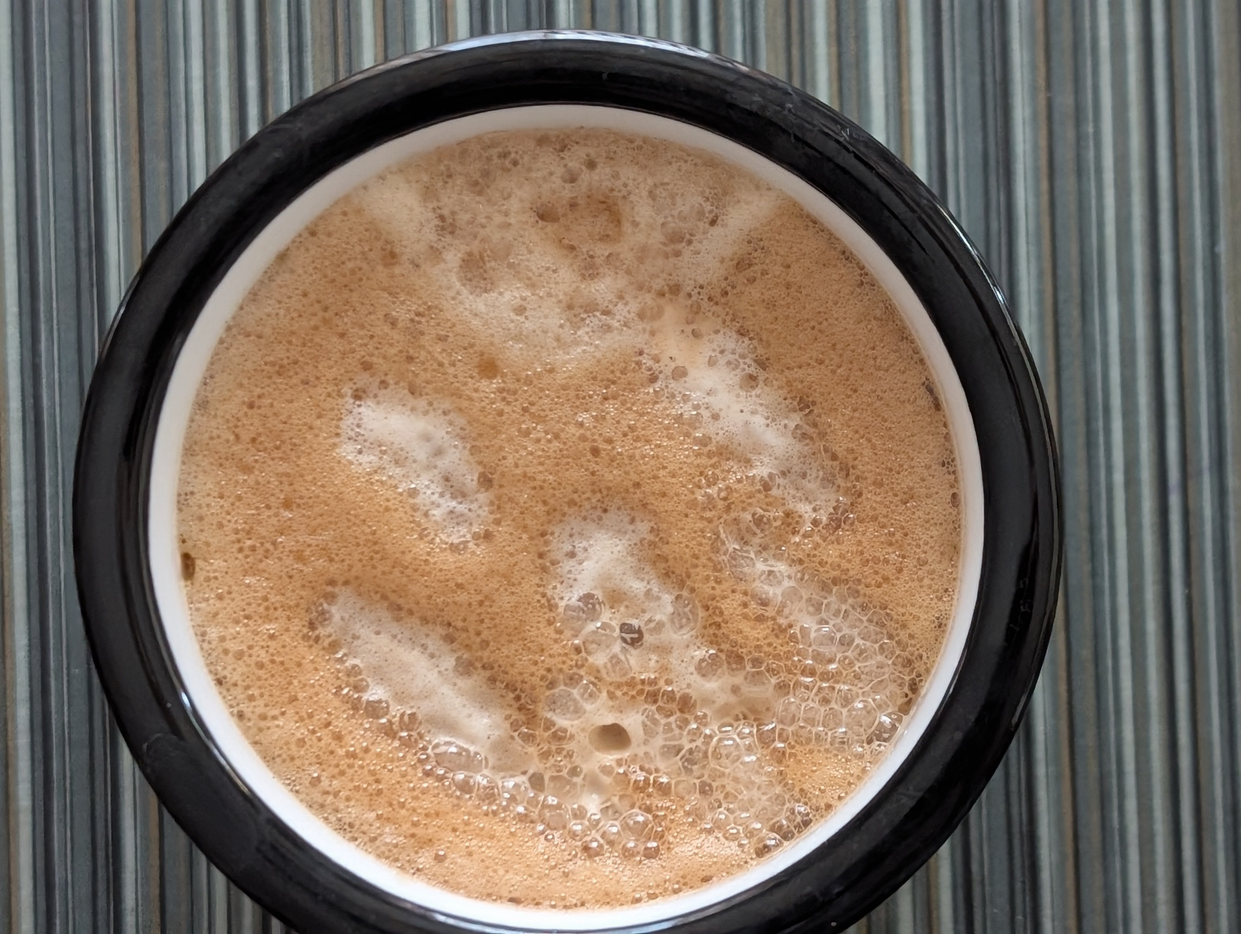 The milk helps tone down the nutmeg.  I tried making a smiley face when I poured the milk, but it ended up looking like a really bad jack-o'-lantern.