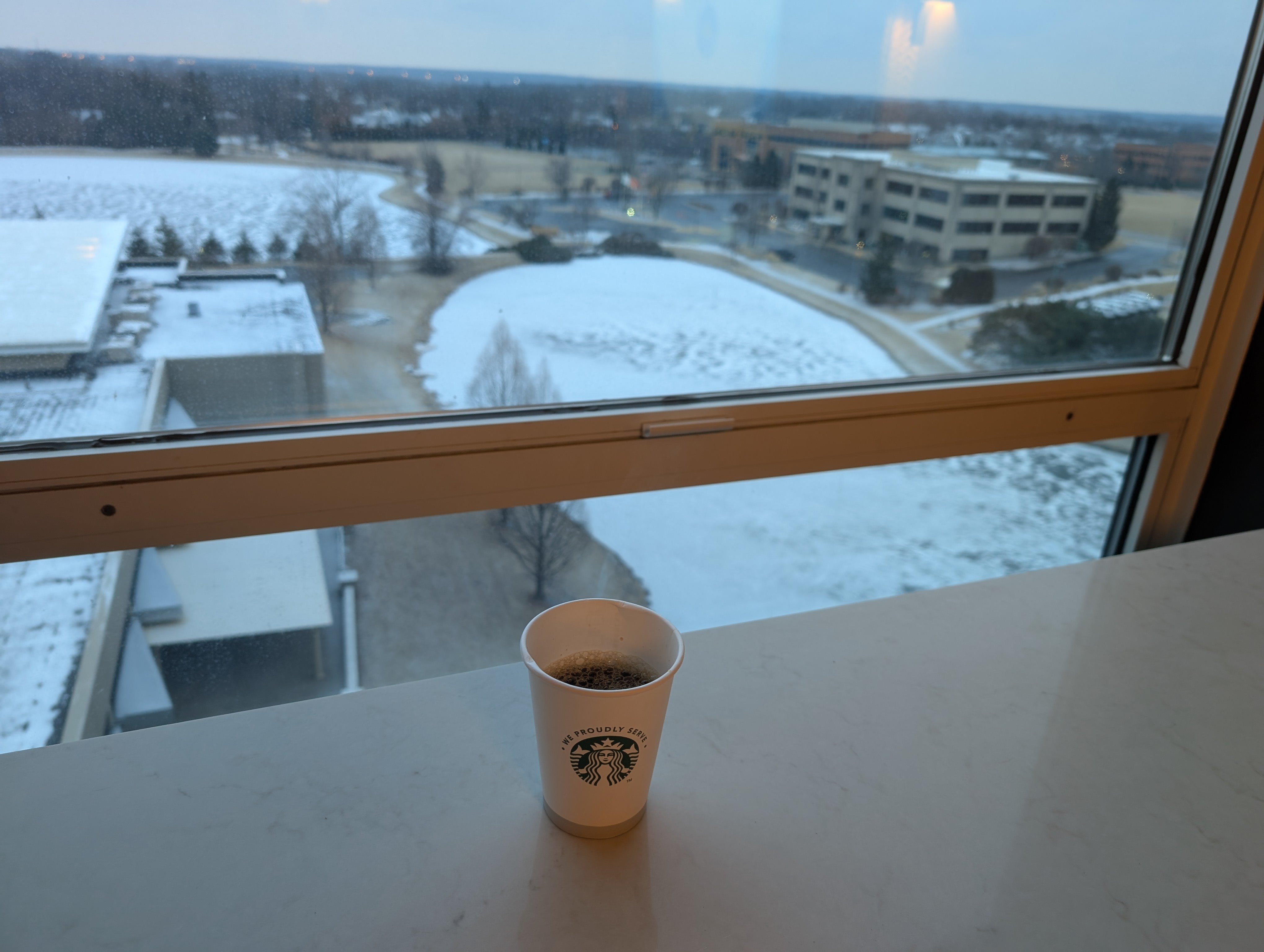 Having a coffee before the snow.  Time to find a spot to attend the meeting from the hotel.