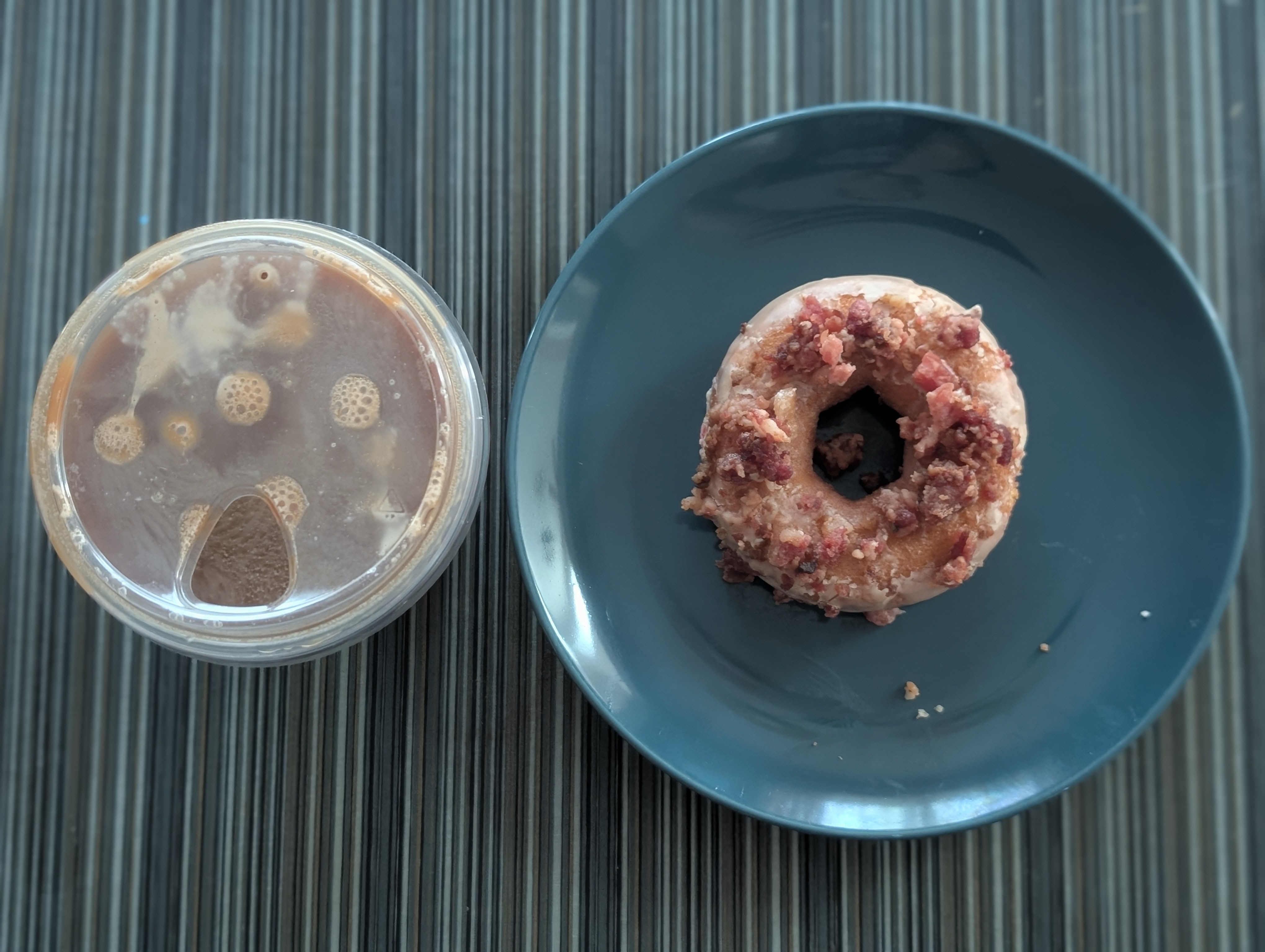 Having a maple bacon Duck Donut with a nitro cold brew.  Unfortunately it looks like a lot of the bacon came off :(