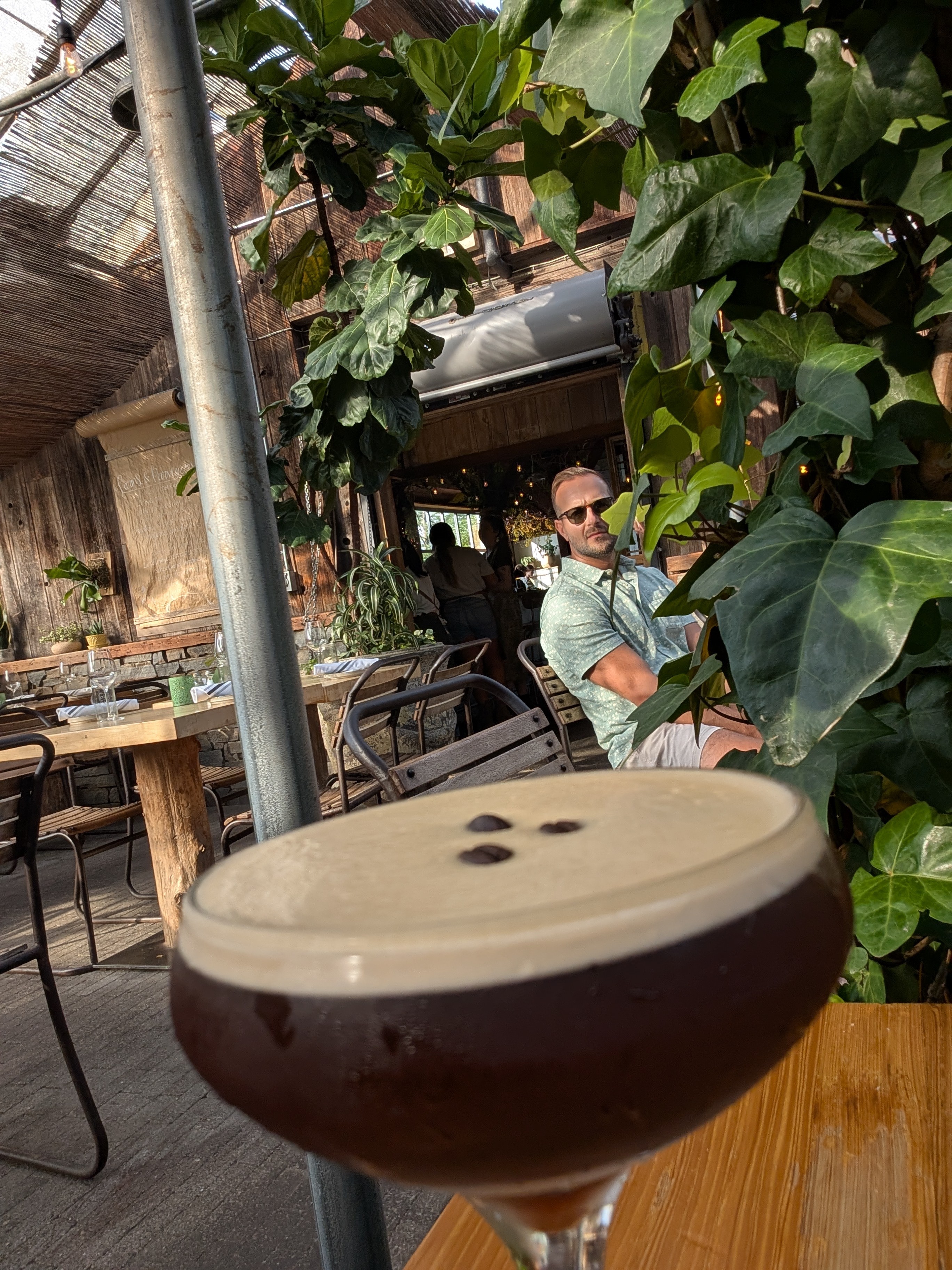 Espresso martini after dinner.  The restaurant is in a greenhouse.