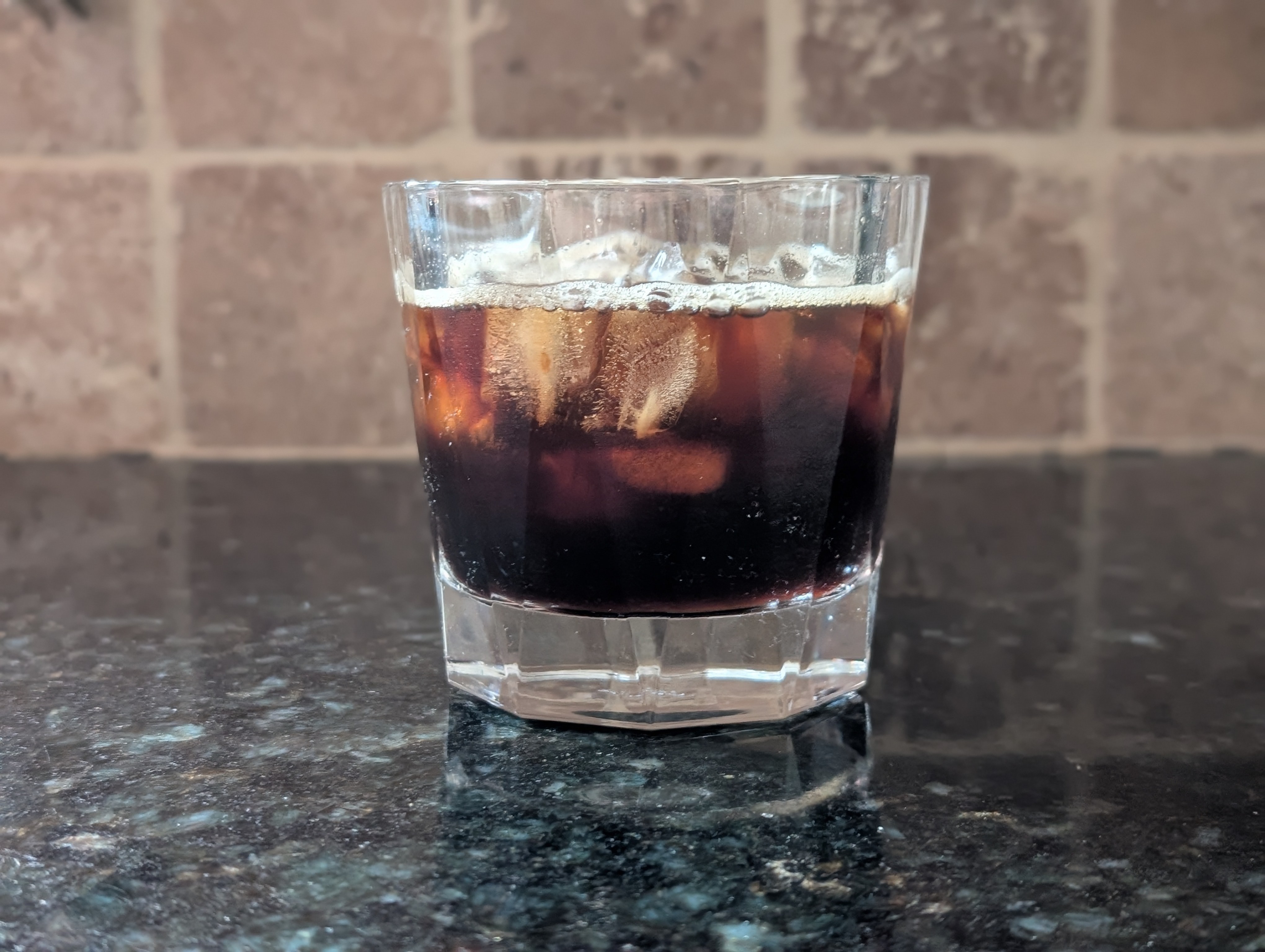 I tried getting more coffee by use the capsule twice (bad idea) which ended up making the espresso less strong.  I dusted the ice with some brown sugar to provide a subtle sweetness, but the diluted espresso muted the whole iced espresso.