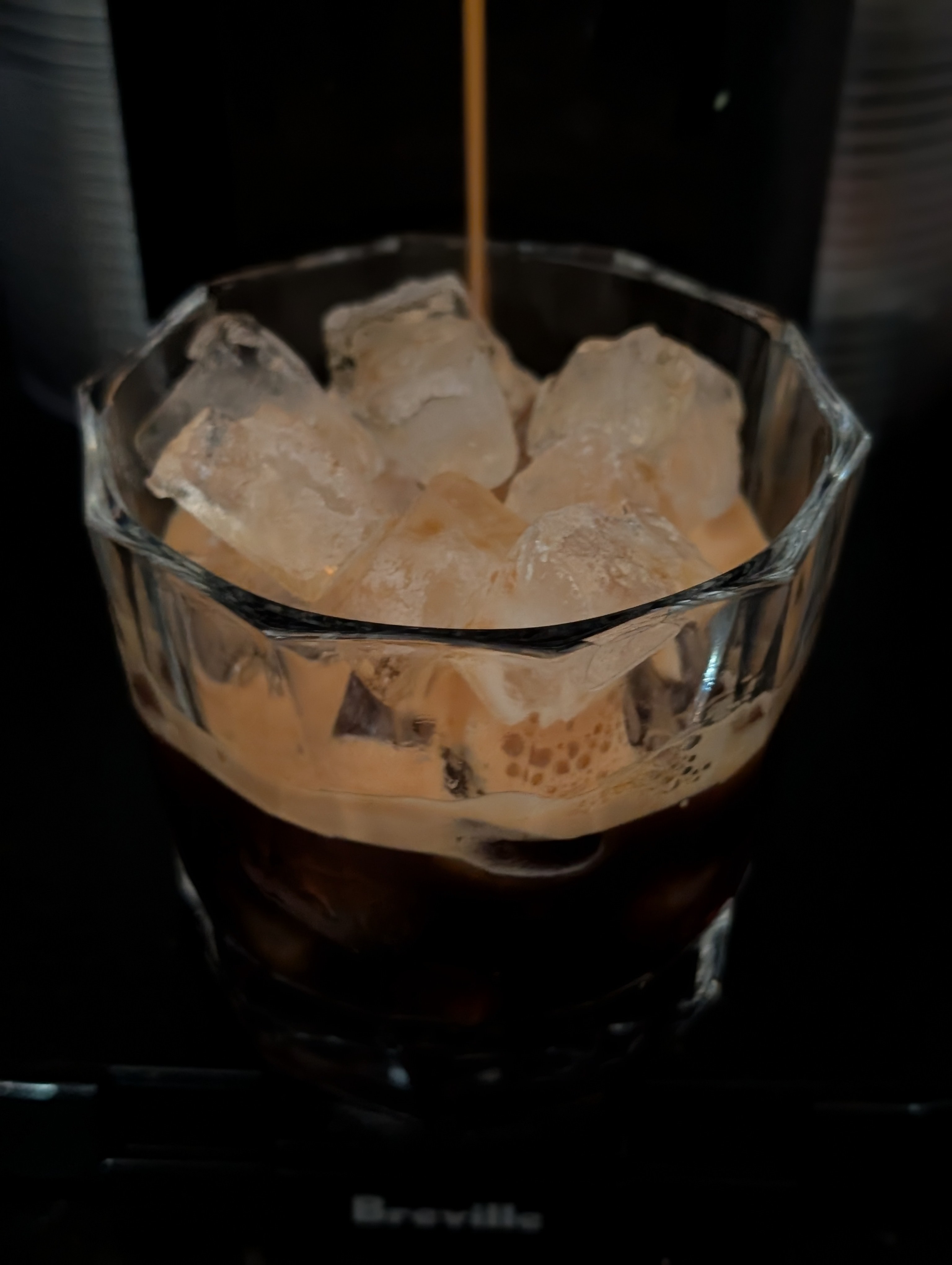Having an iced espresso late in the day before heading to happy hour