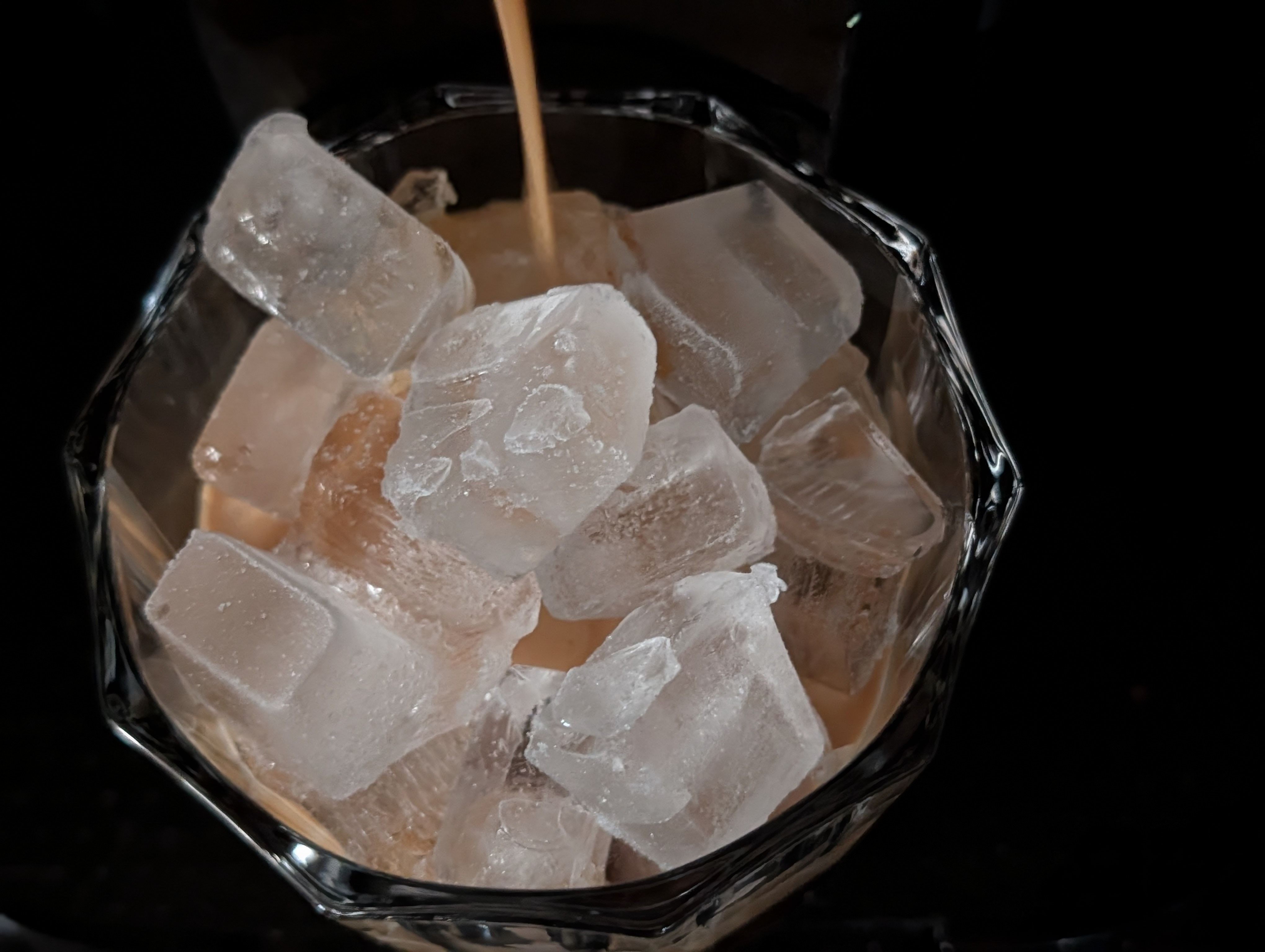 Making a cold iced double espresso before another busy day of meetings